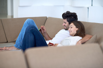 Image showing couple at modern home using tablet computer