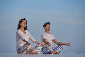 Image showing young couple practicing yoga