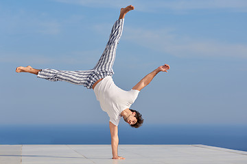 Image showing young man practicing yoga