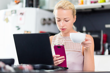 Image showing Business woman working from home.