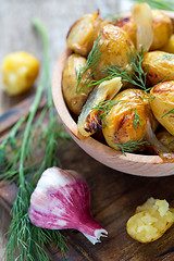 Image showing Baked potatoes, dill and garlic.