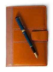 Image showing Fountain pen on top of the closed notebook top view