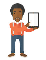 Image showing Black guy holding a digital tablet. 