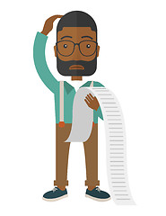 Image showing Sad african-american employee holding a list of payables.