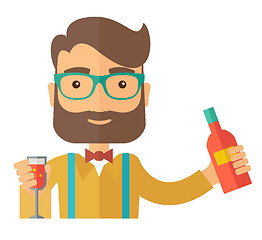 Image showing Bartender at the bar holding a drinks.