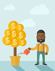 Image showing African businessman happily watering the money tree.