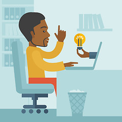 Image showing Black guy working inside his office.