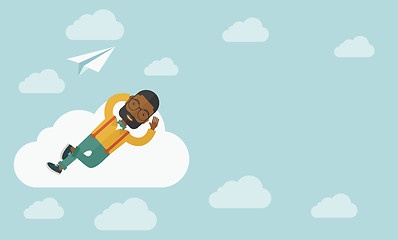 Image showing Black man lying on a cloud with paper plane.