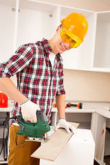 Image showing Master laying parquet