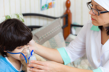 Image showing doctor pediatrician spends boy inhalation