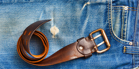 Image showing vintage belt on old blue jeans