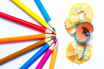 Image showing seven colored pencils and shavings