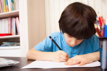 Image showing schoolboy doing homework