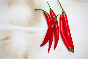 Image showing chili pepper on a wooden surface