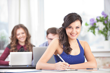 Image showing girl with pen at classroom