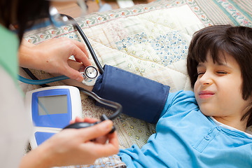 Image showing Doctor pediatrician measure blood pressure