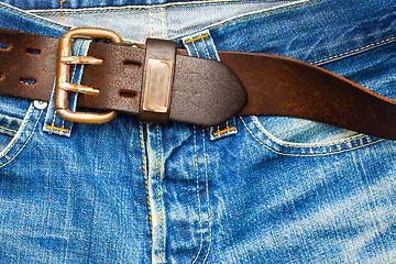 Image showing leather belt on old jeans