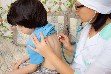 Image showing doctor with stethoscope and boy