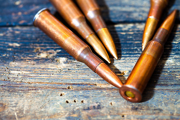 Image showing Still life with five rifle cartridges