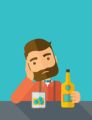 Image showing Sad man alone in the bar drinking beer.