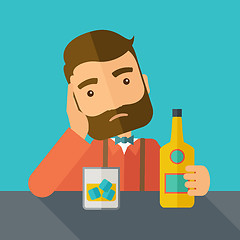 Image showing Sad man alone in the bar drinking beer.
