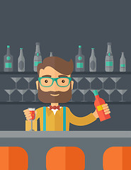 Image showing Bartender at the bar holding a drinks.