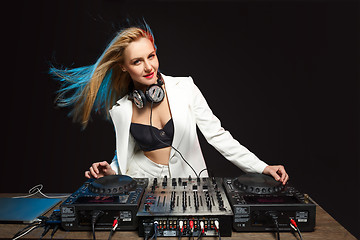 Image showing Beautiful blonde DJ girl on decks - the party,