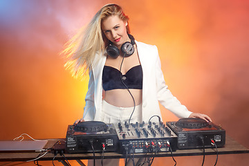 Image showing Beautiful blonde DJ girl on decks - the party,