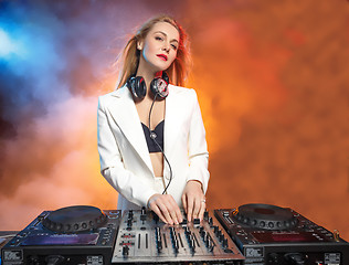 Image showing Beautiful blonde DJ girl on decks - the party,