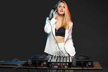 Image showing Beautiful blonde DJ girl on decks - the party,