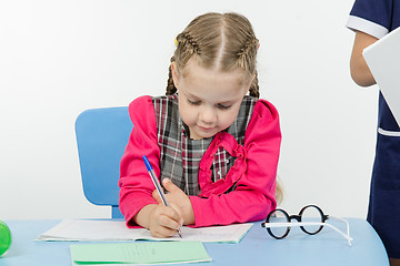 Image showing First-grader a lesson at school