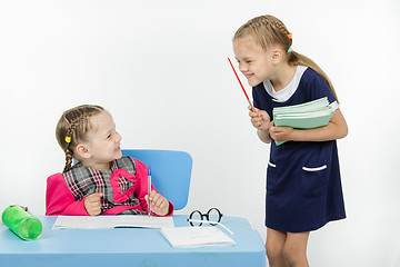 Image showing Teacher and student happily smile at each other