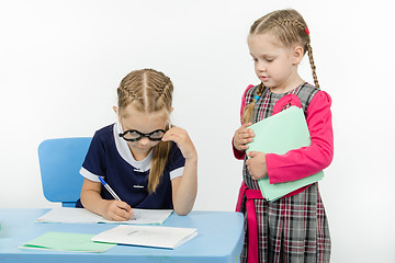 Image showing The girl went to desk other girls