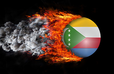 Image showing Flag with a trail of fire and smoke - Comoros