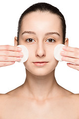 Image showing skin care woman removing face with cotton swabs