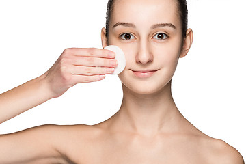 Image showing skin care woman removing face with cotton swab pad