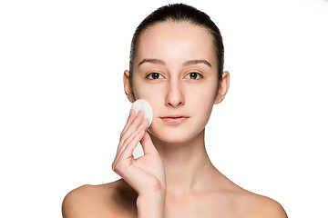 Image showing skin care woman removing face with cotton swab pad