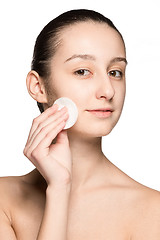 Image showing skin care woman removing face with cotton swab pad