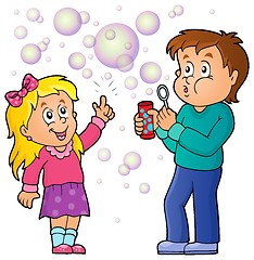 Image showing Children playing with bubble kit theme 1