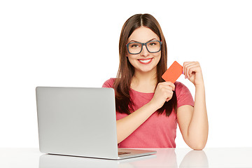 Image showing smiling businesswoman with laptop and credit card