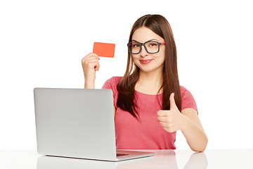 Image showing smiling businesswoman with laptop and credit card