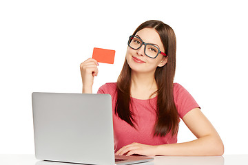 Image showing smiling businesswoman with laptop and credit card