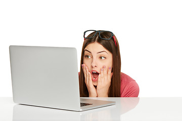 Image showing Surprised girl with laptop
