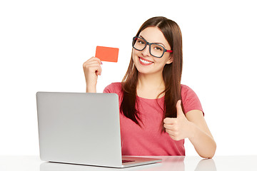 Image showing smiling businesswoman with laptop and credit card