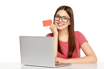 Image showing smiling businesswoman with laptop and credit card