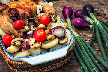 Image showing delicious chicken baked potato and fresh vegetables