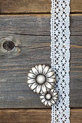 Image showing vintage metal buttons flowers and lace ribbons