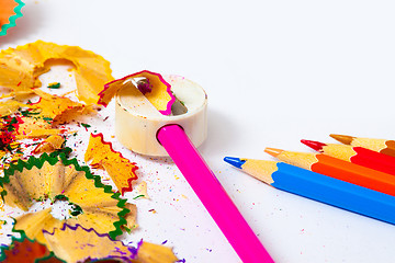 Image showing set of colored pencils, sharpener and shavings 