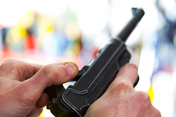 Image showing Luger automatic pistol in a human hand