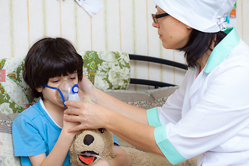 Image showing doctor spends boy inhalation